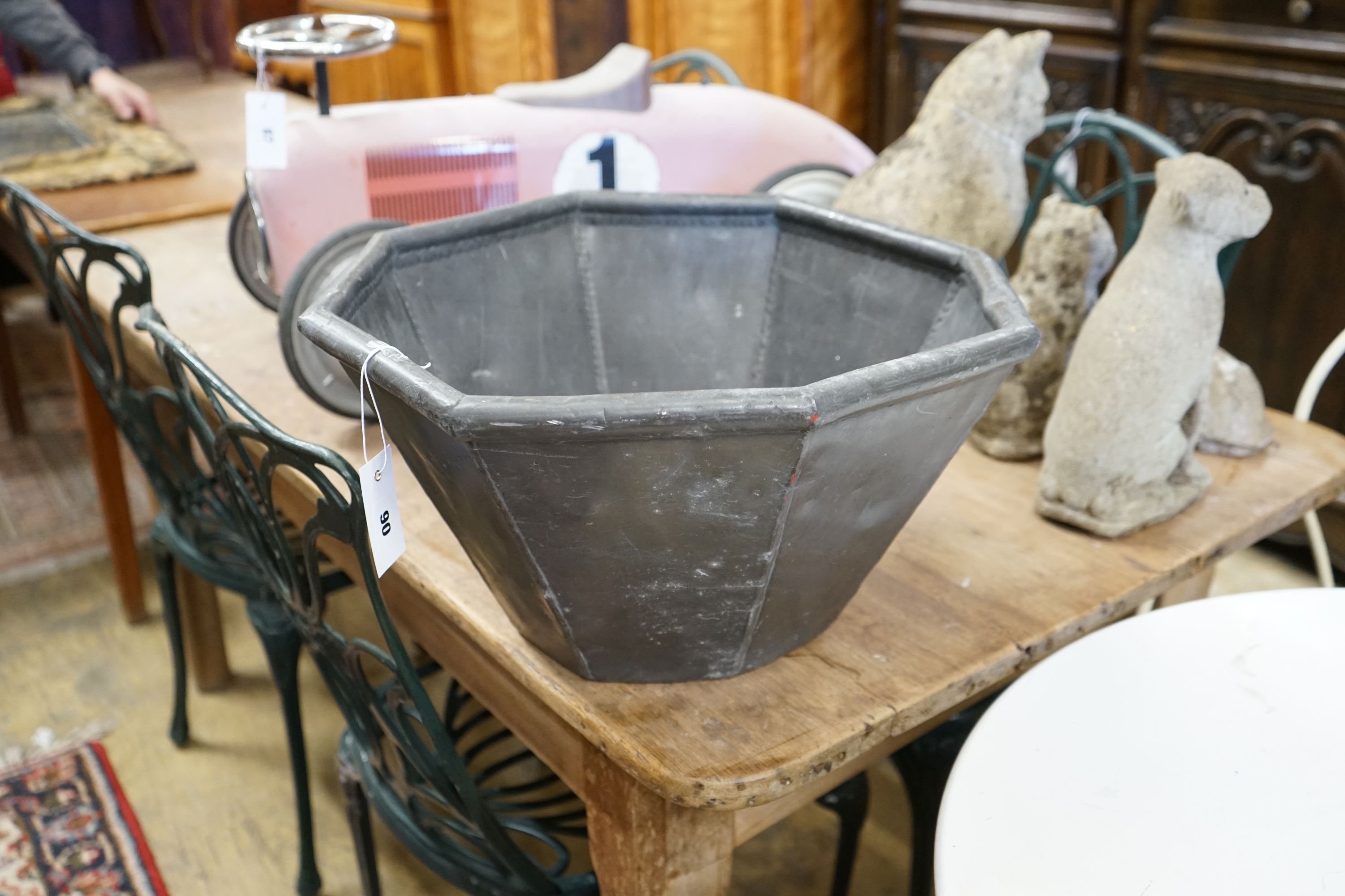 An octagonal lead garden planter, width 44cm, height 25cm